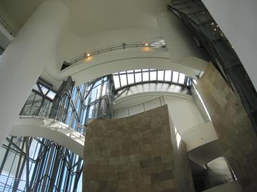 Looking up from atrium floor: limestone and glass